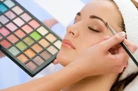 image of woman and palette of make up